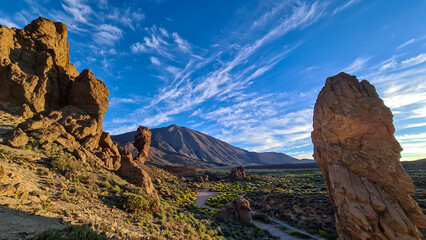 Scenic golden hour sunrise morning view on unique rock formation Roque Cinchado, Roques de Garcia, Mount El Teide National Park, Tenerife, Canary Islands, Spain, Europe. Pico del Teide volcano summit