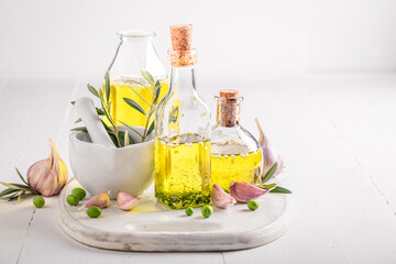 Aromatic and healthy oil in bottle with garlic.