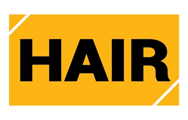 HAIR text written on yellow-black stamp sign.