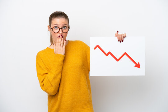 Young caucasian woman isolated on white background holding a sign with a decreasing statistics arrow symbol with surprised expression