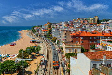 Train at the station of the seaside town of Sant pol de mar in Catalonia, Spain