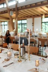 Elegant table setting and decoration for a dinner at a wedding location