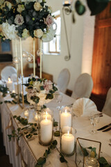 Elegant table setting and decoration for a dinner at a wedding location