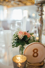 Elegant table setting and decoration for a dinner at a wedding location