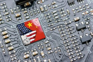 Flag of USA and China on a processor, CPU or GPU microchip on a motherboard. US companies have...