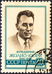 USSR - CIRCA 1959: A stamp printed in USSR shows portrait of Jean Frederick Joliot Curie 1900-1958 .
