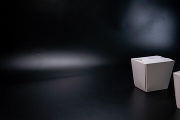 White delivery Box, container for asian food, wok. Isolated on black background. Copy space. the...