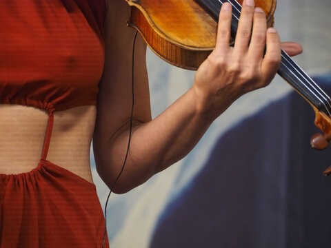 Woman plays a concert violin