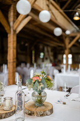 Elegant table setting and decoration for a dinner at a wedding location