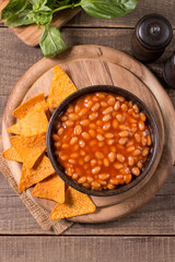 Chili beans on wooden table background. Kidney beans and vegetable Mexican food. 