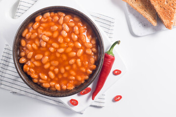 Chili beans on wooden table background. Kidney beans and vegetable Mexican food. 