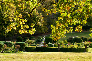 Port Arthur Australia, view across park to garden with fountain on a sunny autumn day
