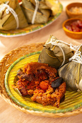 Zongzi or Bakcang is a traditional Chinese rice dish made of glutinous rice stuffed with different fillings and wrapped in bamboo leaves. They are cooked by steaming or boiling