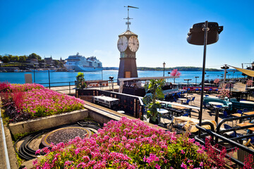 Scenic harbor of Oslo in Aker Brygge with clock tower view - obrazy, fototapety, plakaty