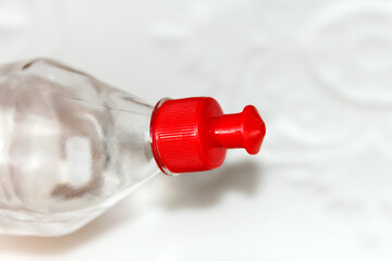 Bottle with acrylic, versatile, transparent glue designed for repair work, stands against the...