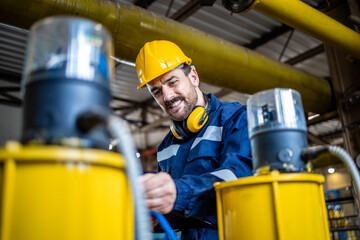 Refinery expert taking samples and checking quality of liquified petroleum gas in production plant.