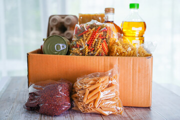 Foodstuffs in donation box for volunteer.