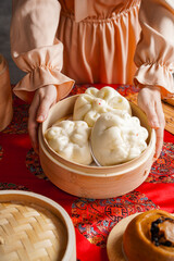 Baozi or bao, is a type of yeast-leavened filled bun in various Chinese cuisines. There are many variations in fillings, though the buns are most often steamed. 