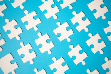 White part of jigsaw puzzle pieces on blue background. concepts of problem solving, business...