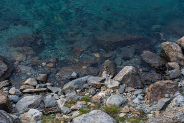 Fototapeta na wymiar Clear aqua waters in the tarns on Mount Snowdon in Wales, UK