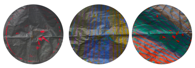 macro top shot photo of three foil sticker with nice stripe texture, round plastic sticker.