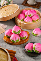 Sienthou  peach is a symbol of longevity. Baozi or Bakpao is a type of yeast-leavened filled bun in various Chinese cuisines.