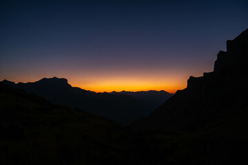 Beautiful sunset on the mountain. Sefinenfurgge Pass with a fantastic view of the swiss alps. Beautiful evening mood. Trekking concept