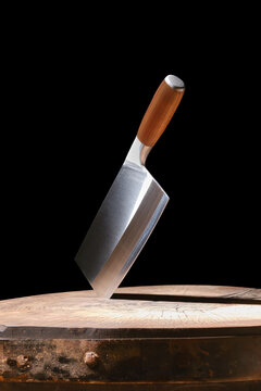 Butcher's cleaver is stuck in the stump