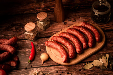 Sausages on wooden board