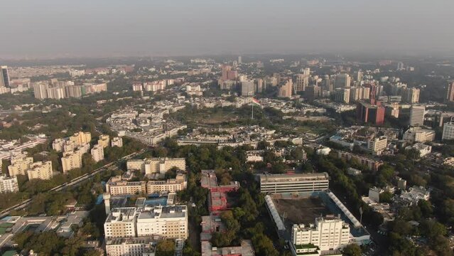 An aerial shot of Connaught Place with cars moving around at New Delhi, India