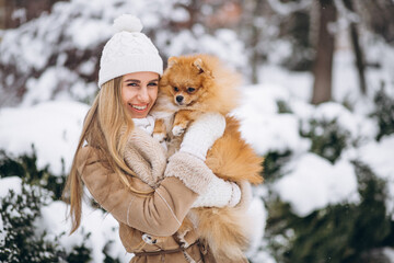 Woman with dog in winter
