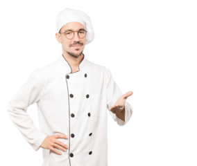 Happy young chef doing a gesture of welcome with his hand