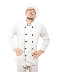 Tired young chef posing against background