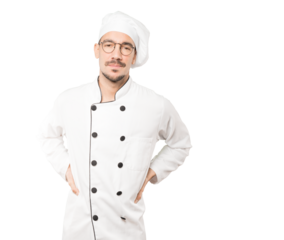 Tired young chef posing against background