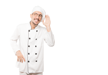 Happy young chef smiling and making a gesture of trying to hear something