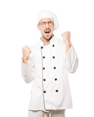 Competitive young chef making a gesture of celebration