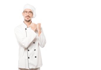 Serious young chef making a gesture of strength
