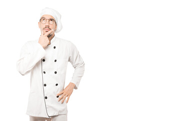 Amazed young chef looking gesture