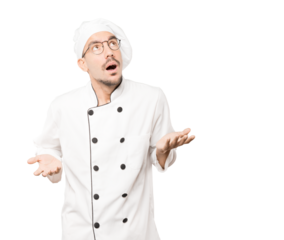 Happy young chef looking up gesture