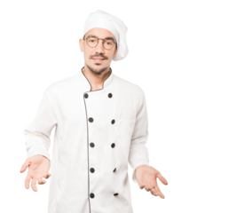 Amazed young chef looking up gesture