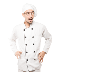 Amazed young chef looking up gesture