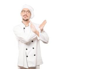 Young chef making a gesture of not crossing with the arms