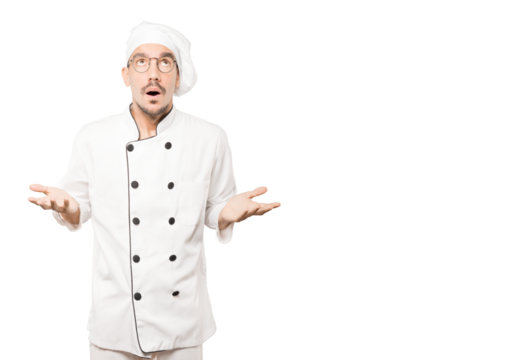 Happy young chef looking up gesture - Powered by Adobe