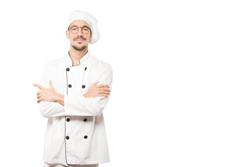 Satisfied young chef with crossed arms gesture