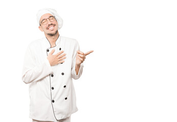 Naughty young chef laughing at you - obrazy, fototapety, plakaty