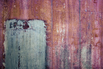rusty iron sheet with corrosion, selective focus, textured background