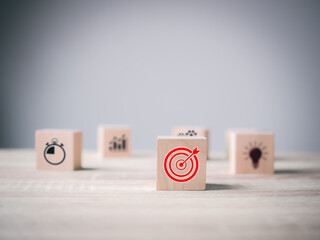 Business goal target achievement concept of business strategy and action plan on wooden cube block...