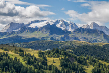 View of Marmolada mountain on the background, the queen of Dolomites alps from the path to Pralongià refuge, Italy.