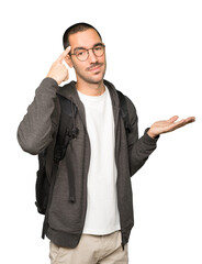 Serious student doing a gesture of concentration