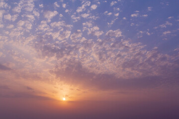 Fototapeta na wymiar picturesque sunrise in a cloudy sky